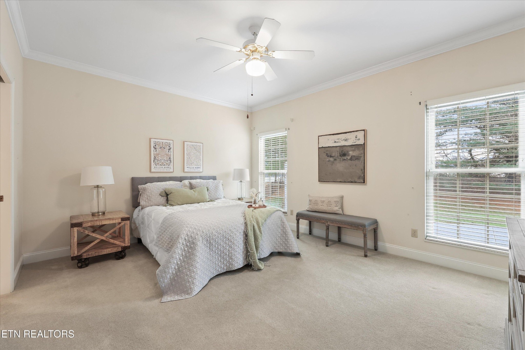 316 English Station Road Knoxville, TN 37934 - Photo 19 of 45 a spacious bedroom with a bed a table and chair