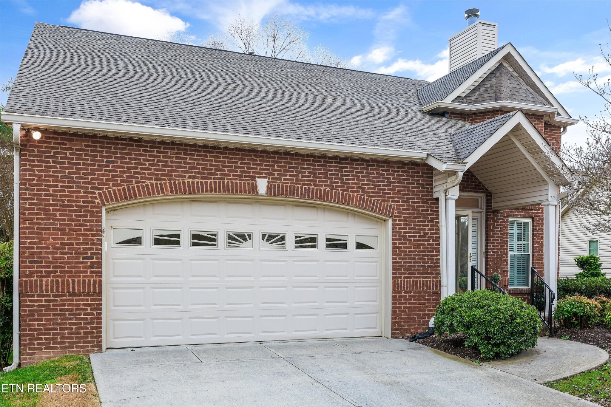 316 English Station Road Knoxville, TN 37934 - Photo 2 of 45 a front view of a house with garage
