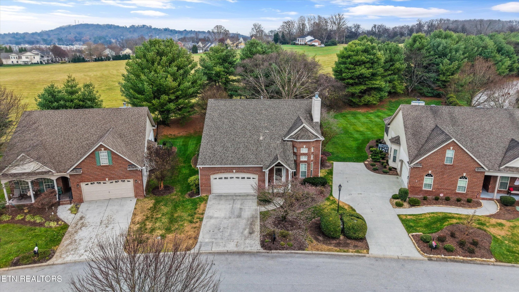 316 English Station Road Knoxville, TN 37934 - Photo 36 of 45 an aerial view of a house with a garden and a yard