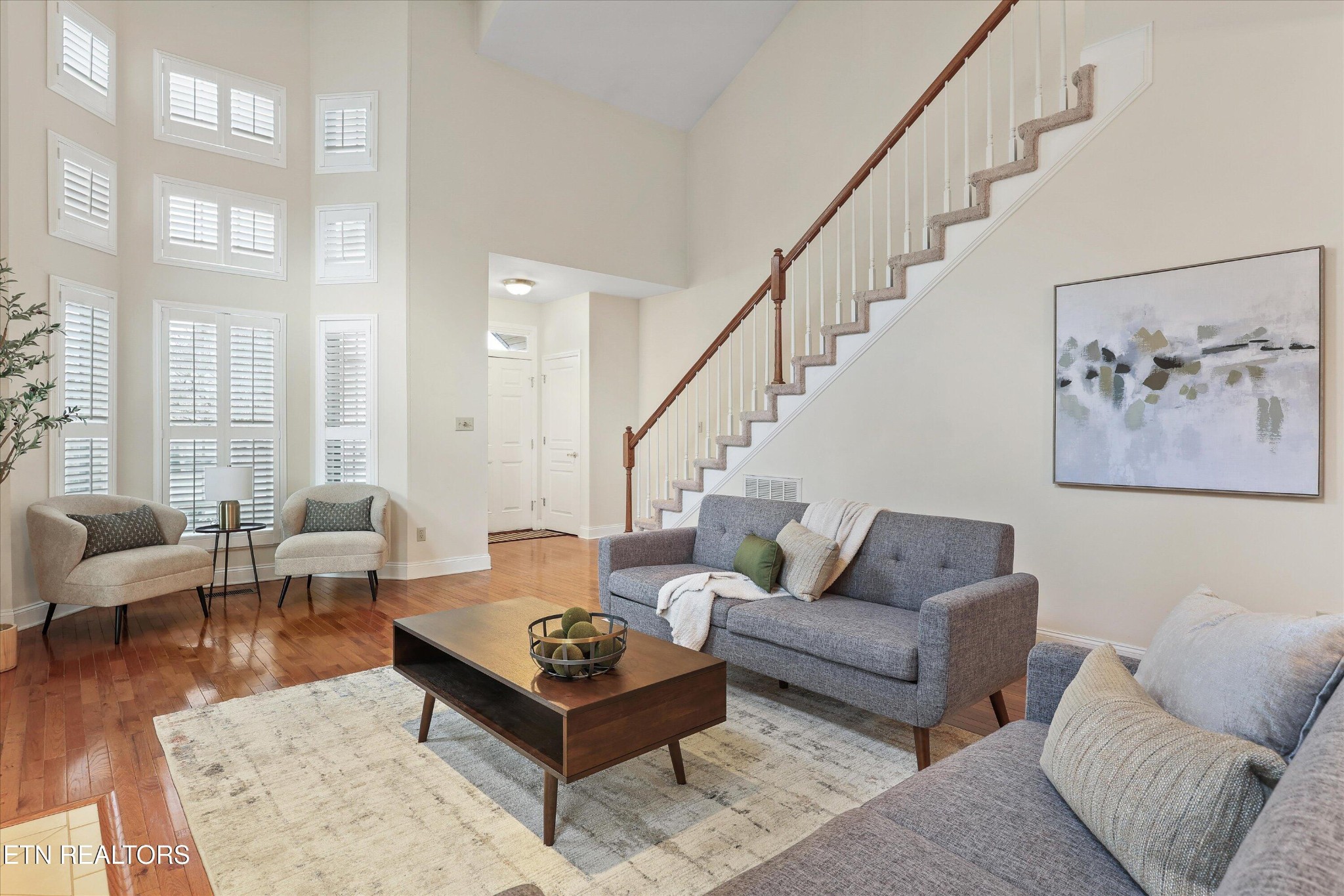 316 English Station Road Knoxville, TN 37934 - Photo 8 of 45 a living room with furniture a rug and a large window