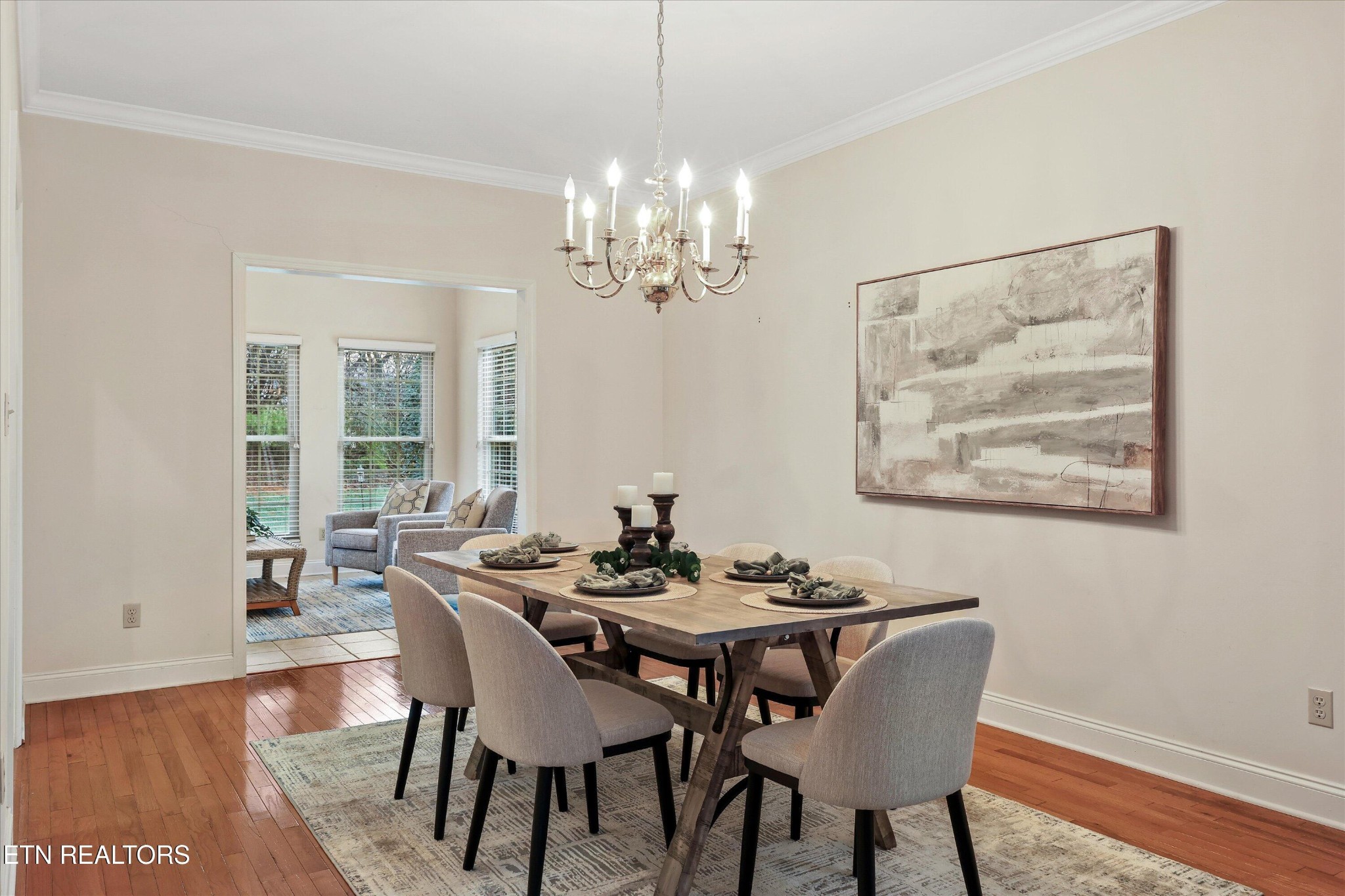316 English Station Road Knoxville, TN 37934 - Photo 9 of 45 a dining room with furniture a chandelier and wooden floor