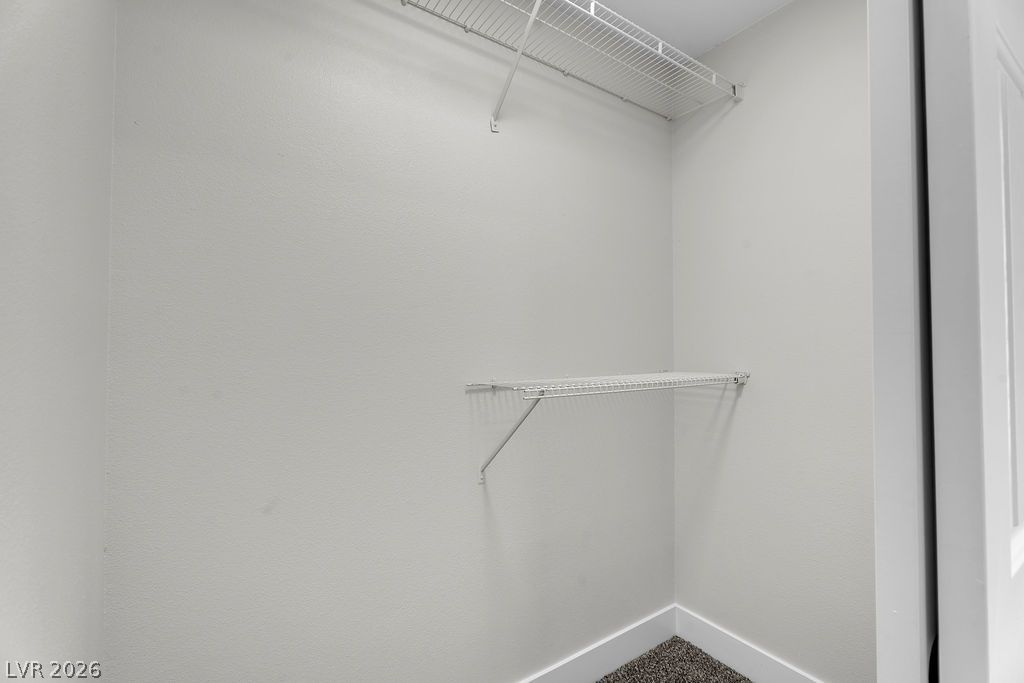 2139 Chapman Ranch Drive Henderson, NV 89012 - Photo 43 of 58 Functional wire shelving and clean walls define this organized closet space.