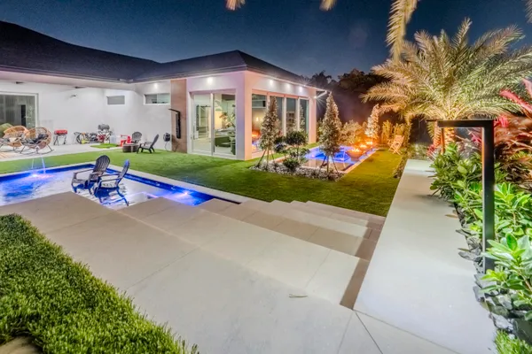 a bathroom with a sink mirror and a window