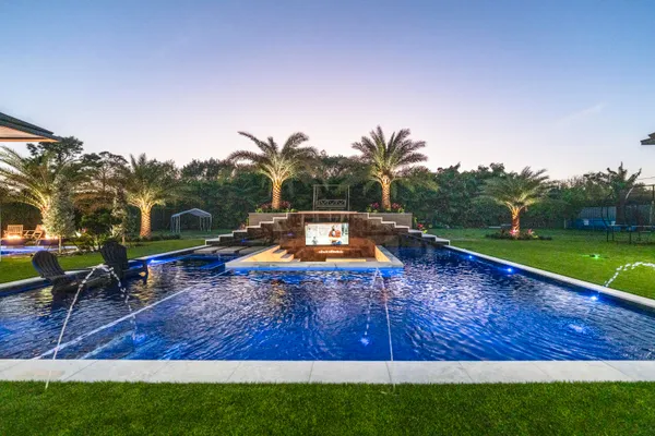 a view of swimming pool with outdoor seating