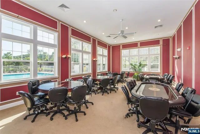 a room with gym equipment and a large window