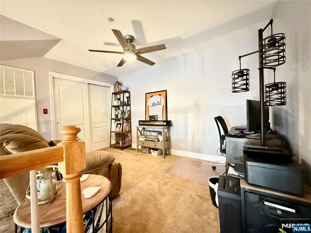 a view of a livingroom with furniture and a flat screen tv
