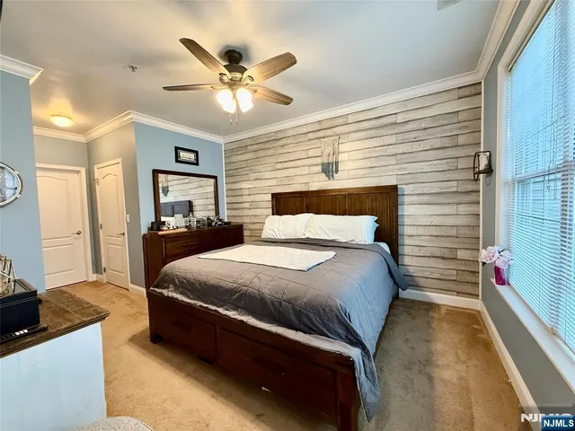 a bed room with a bed and a chandelier