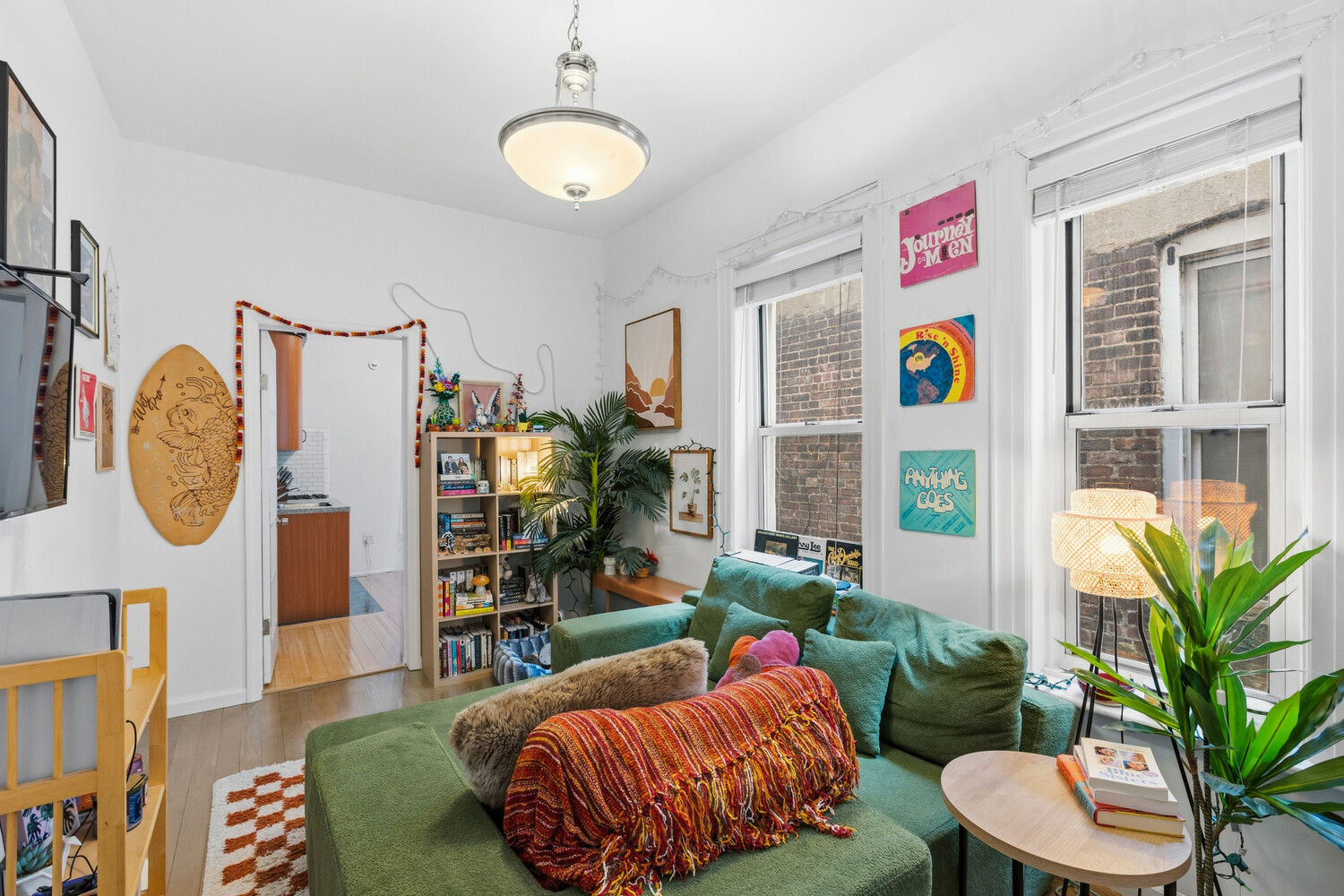 328 East 73rd Street, Unit 5B Manhattan, NY 10021 - Photo 2 of 10 a living room with furniture and a potted plant