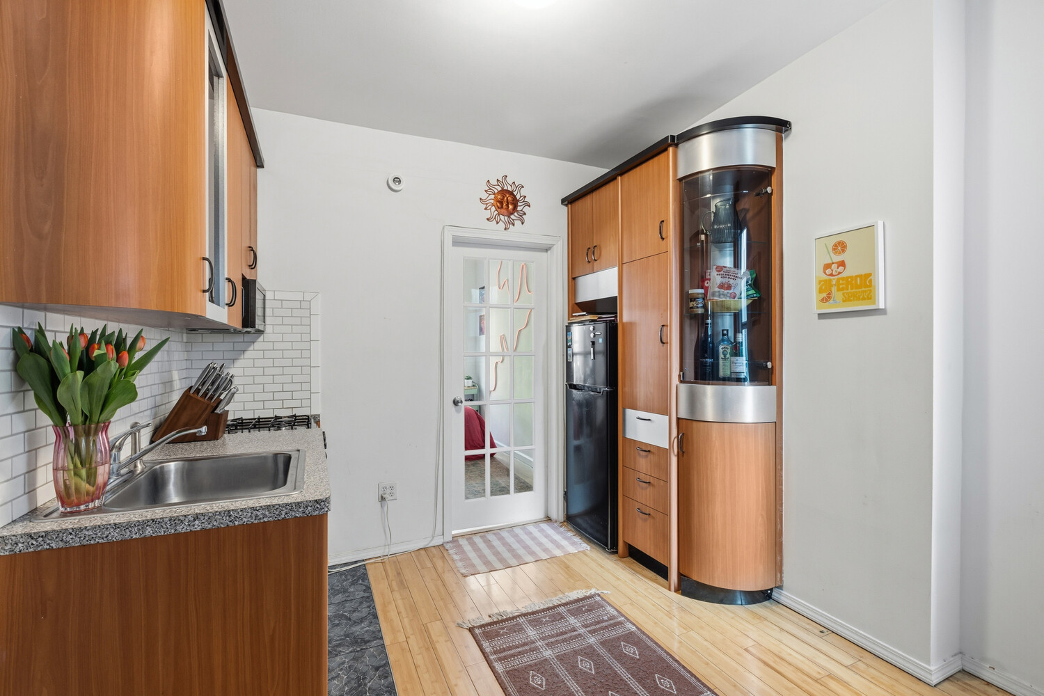 328 East 73rd Street, Unit 5B Manhattan, NY 10021 - Photo 5 of 10 a kitchen with stainless steel appliances granite countertop a refrigerator and a sink