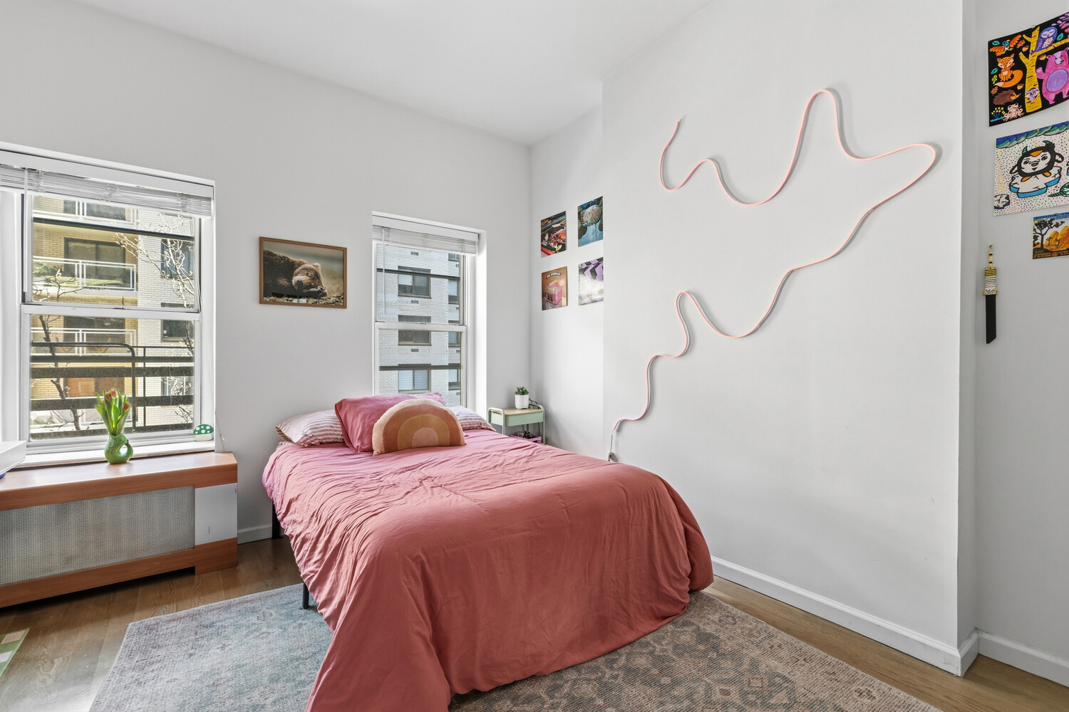 328 East 73rd Street, Unit 5B Manhattan, NY 10021 - Photo 6 of 10 a bedroom with a bed window and a table