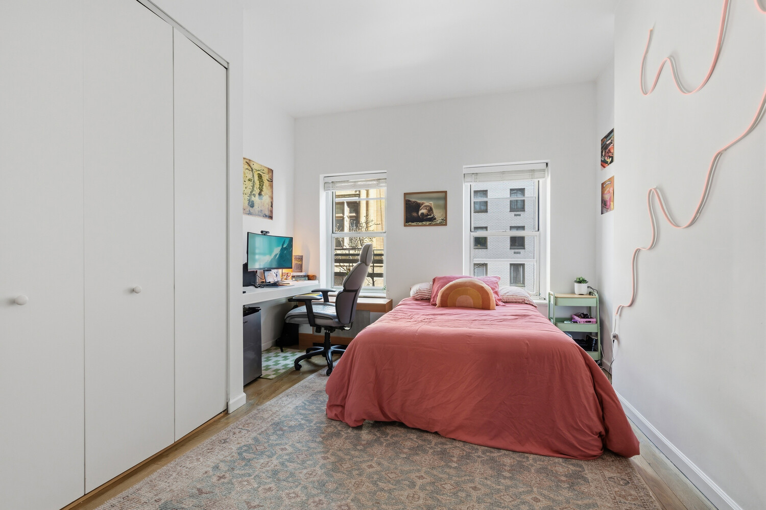 328 East 73rd Street, Unit 5B Manhattan, NY 10021 - Photo 7 of 10 a bed room with a bed and a couch