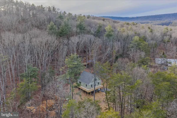 a aerial view of a house with an outdoor space