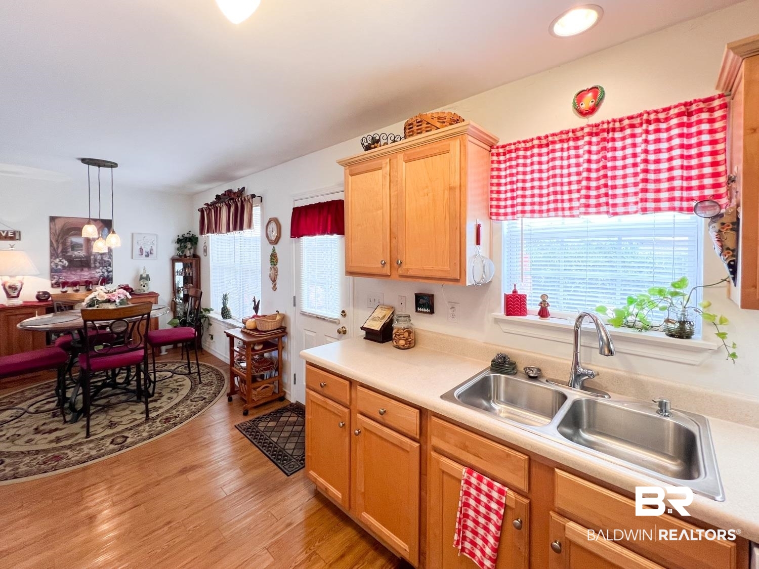 16690 Plum Court Loxley, AL 36551 - Photo 21 of 30 Kitchen with sink, hanging light fixtures, and light wood-type flooring