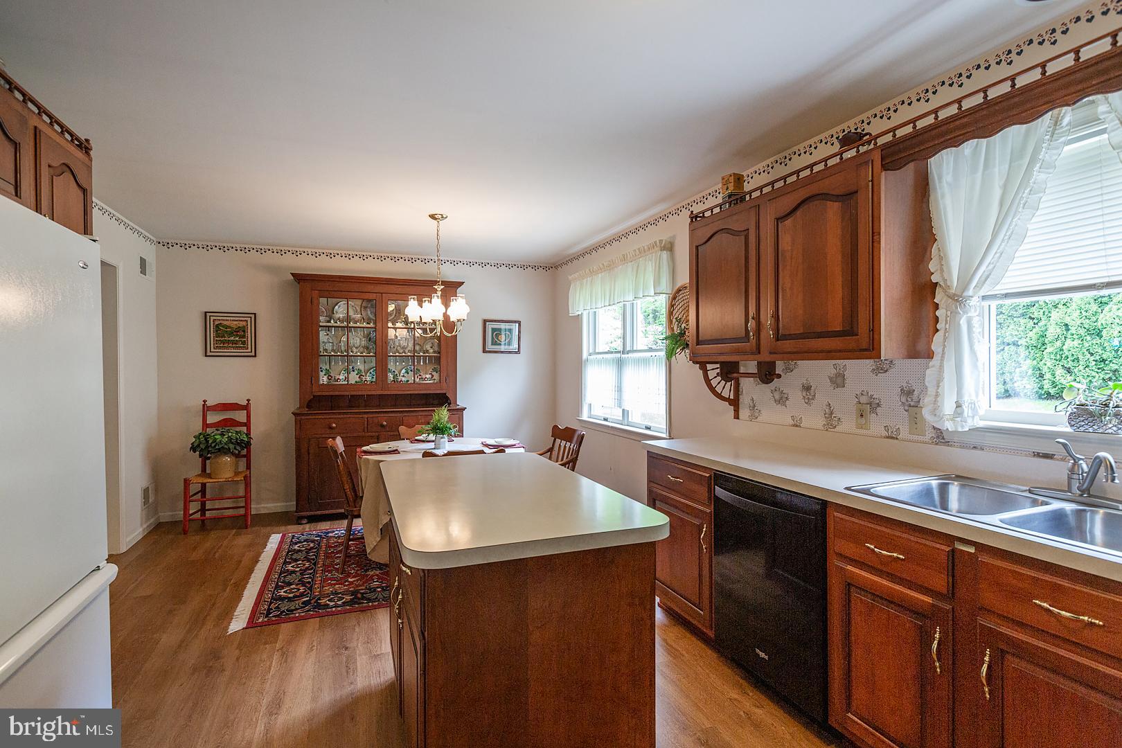 1 Hurst Boulevard Lititz, PA 17543 - Photo 25 of 62 a kitchen with kitchen island granite countertop a sink stove and cabinets