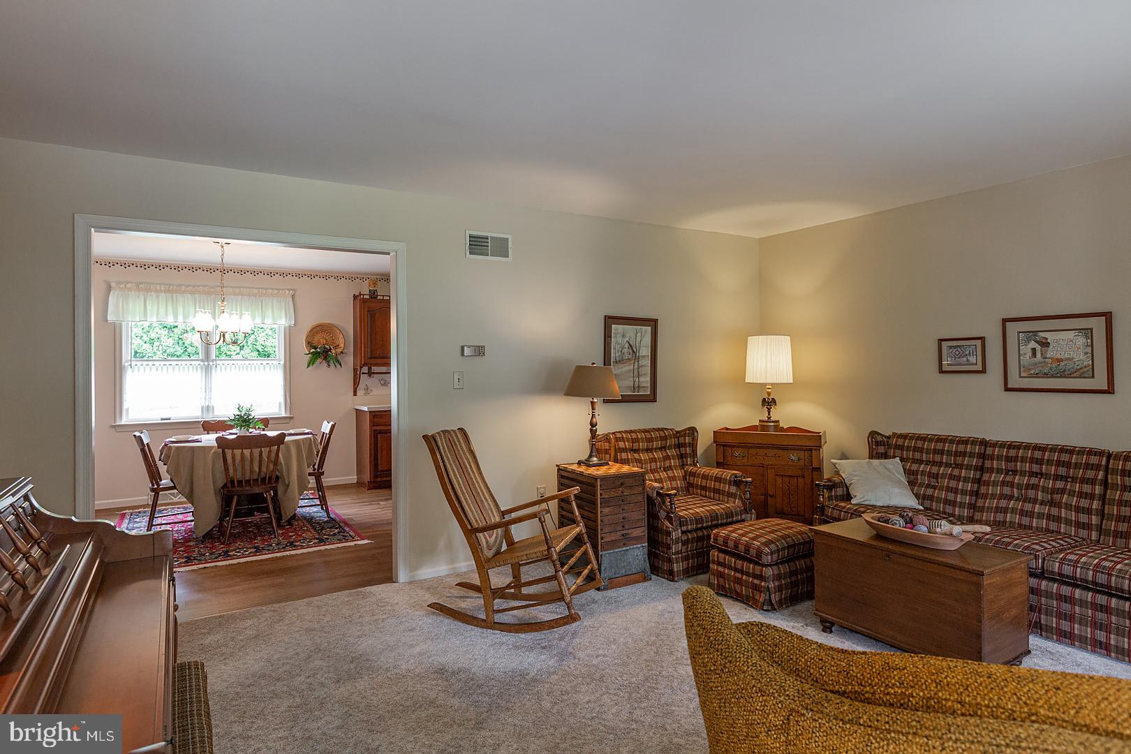 1 Hurst Boulevard Lititz, PA 17543 - Photo 10 of 62 a living room with furniture a dining table and a piano table with wooden floor