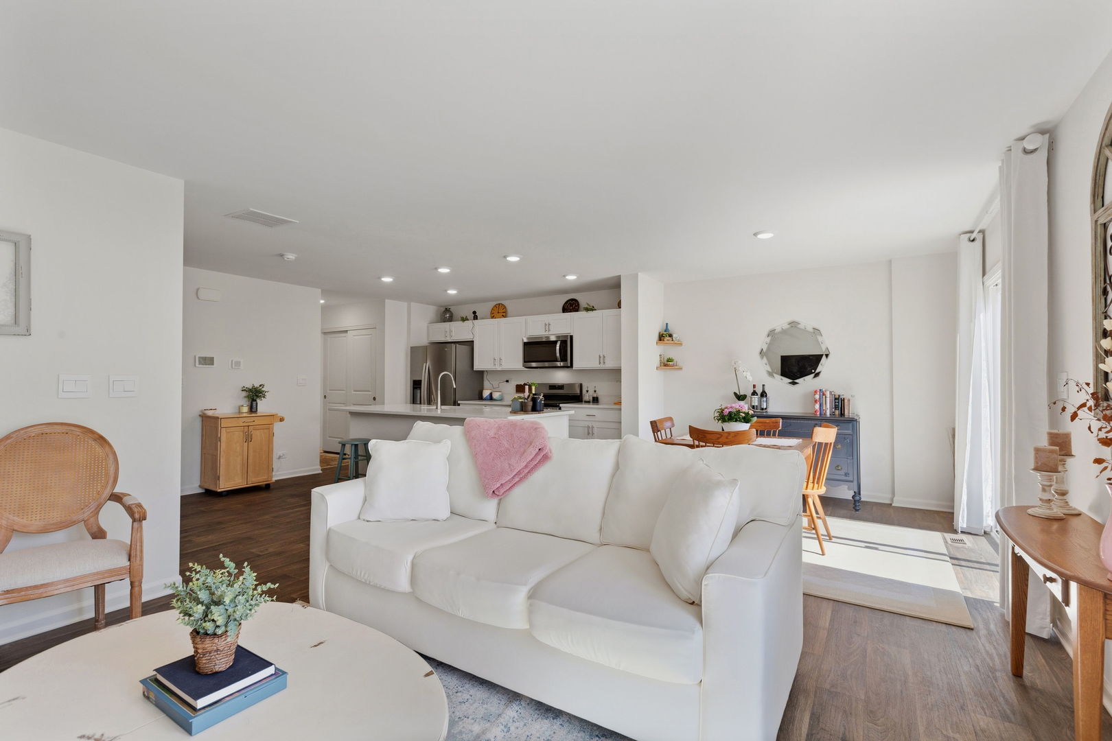 717 Wellington Lane Cary, IL 60013 - Photo 11 of 28 a living room with furniture kitchen view and a couch