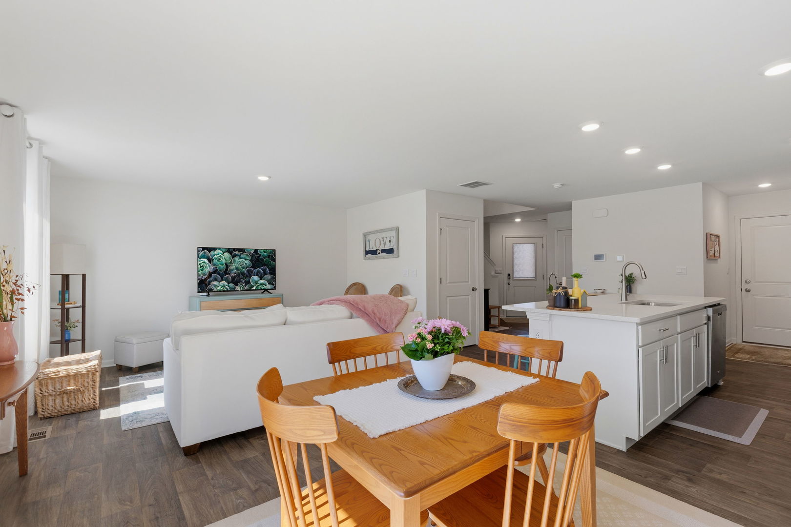 717 Wellington Lane Cary, IL 60013 - Photo 12 of 28 a view of a dining room with furniture and wooden floor