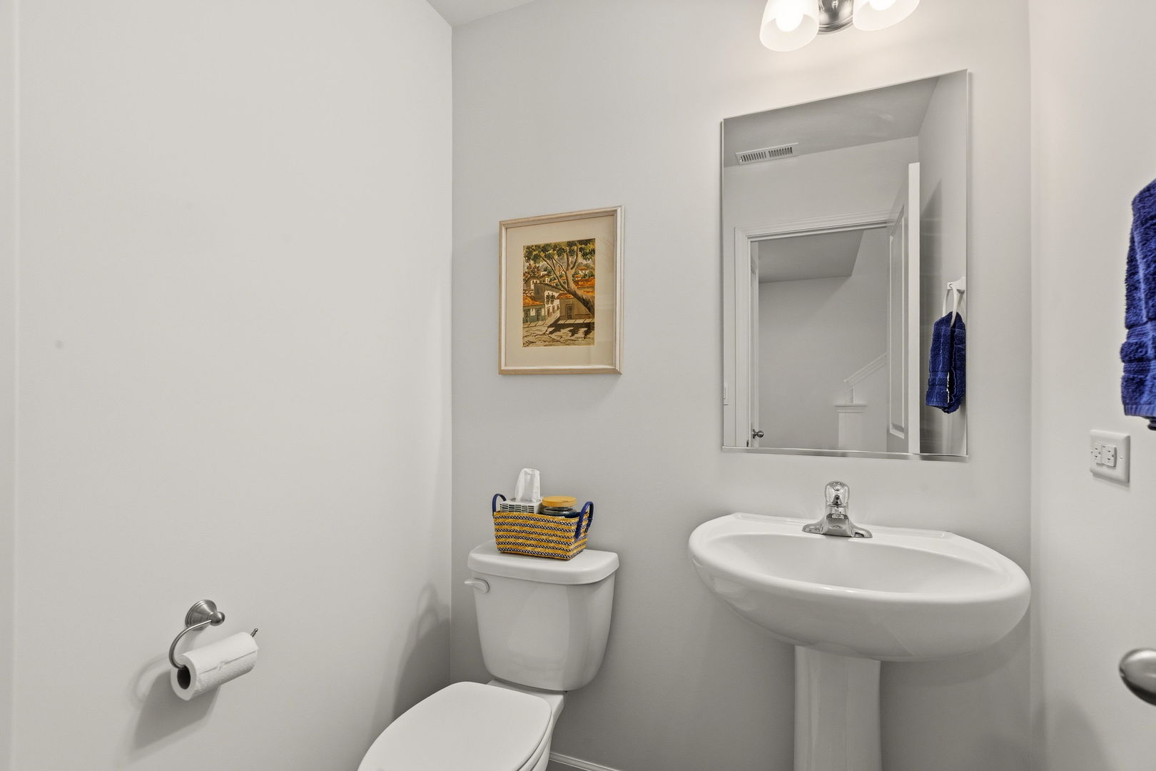 717 Wellington Lane Cary, IL 60013 - Photo 13 of 28 a bathroom with a toilet sink and mirror