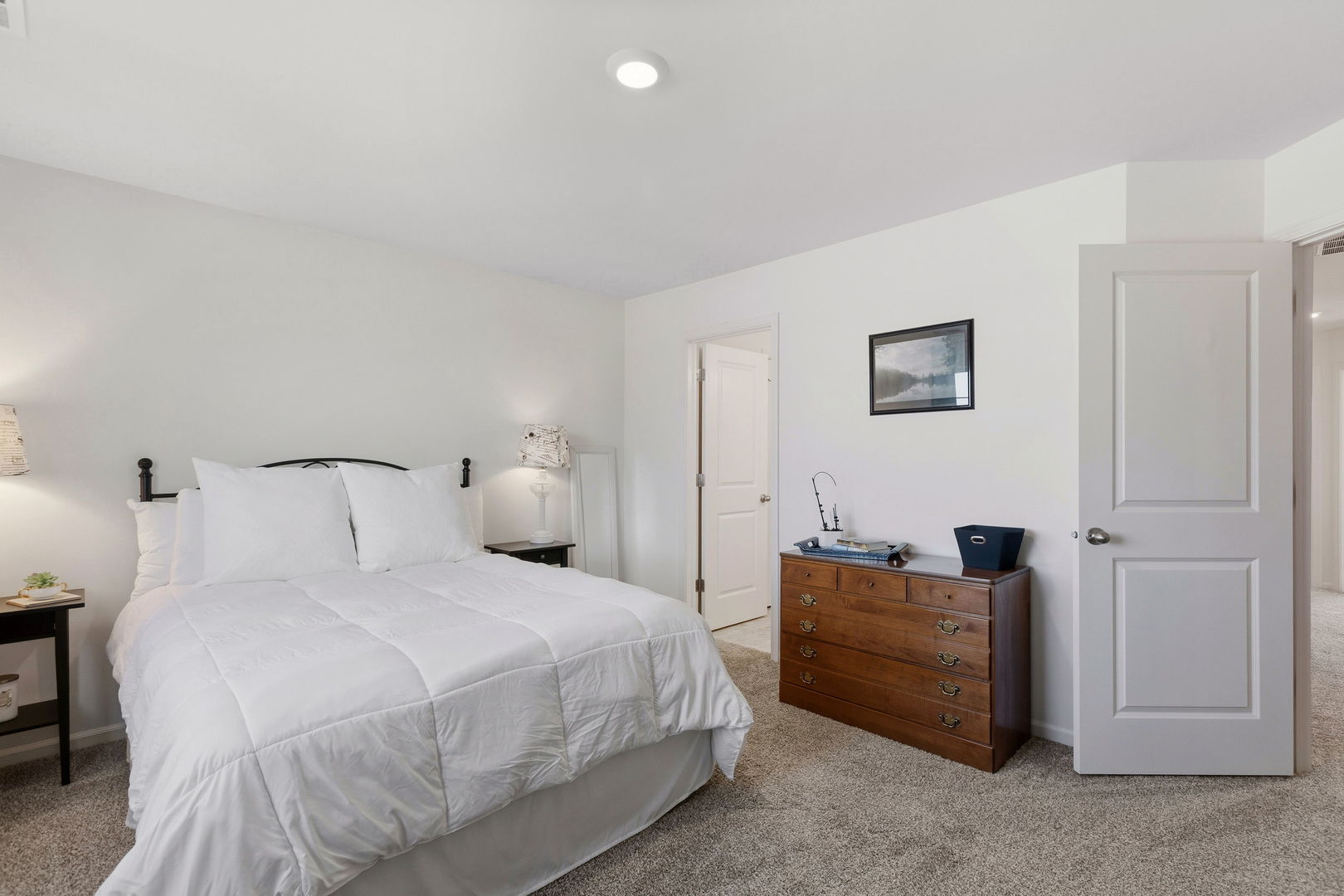 717 Wellington Lane Cary, IL 60013 - Photo 16 of 28 a bedroom with a bed and a night stand