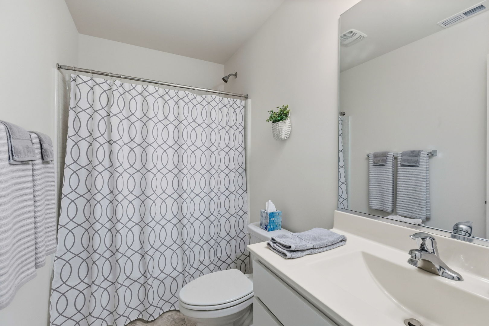 717 Wellington Lane Cary, IL 60013 - Photo 18 of 28 a bathroom with a granite countertop toilet sink and mirror