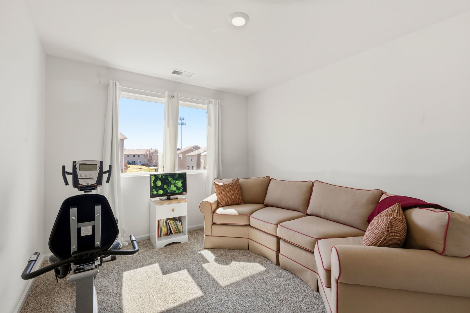 717 Wellington Lane Cary, IL 60013 - Photo 19 of 28 a living room with furniture and a window