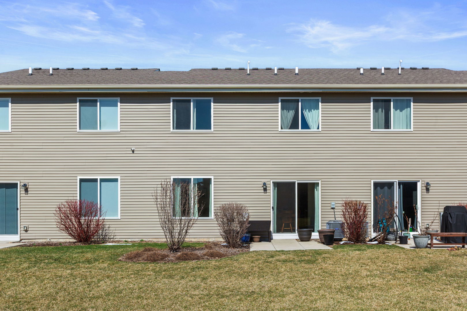 717 Wellington Lane Cary, IL 60013 - Photo 22 of 28 a backyard of a house with yard and outdoor seating