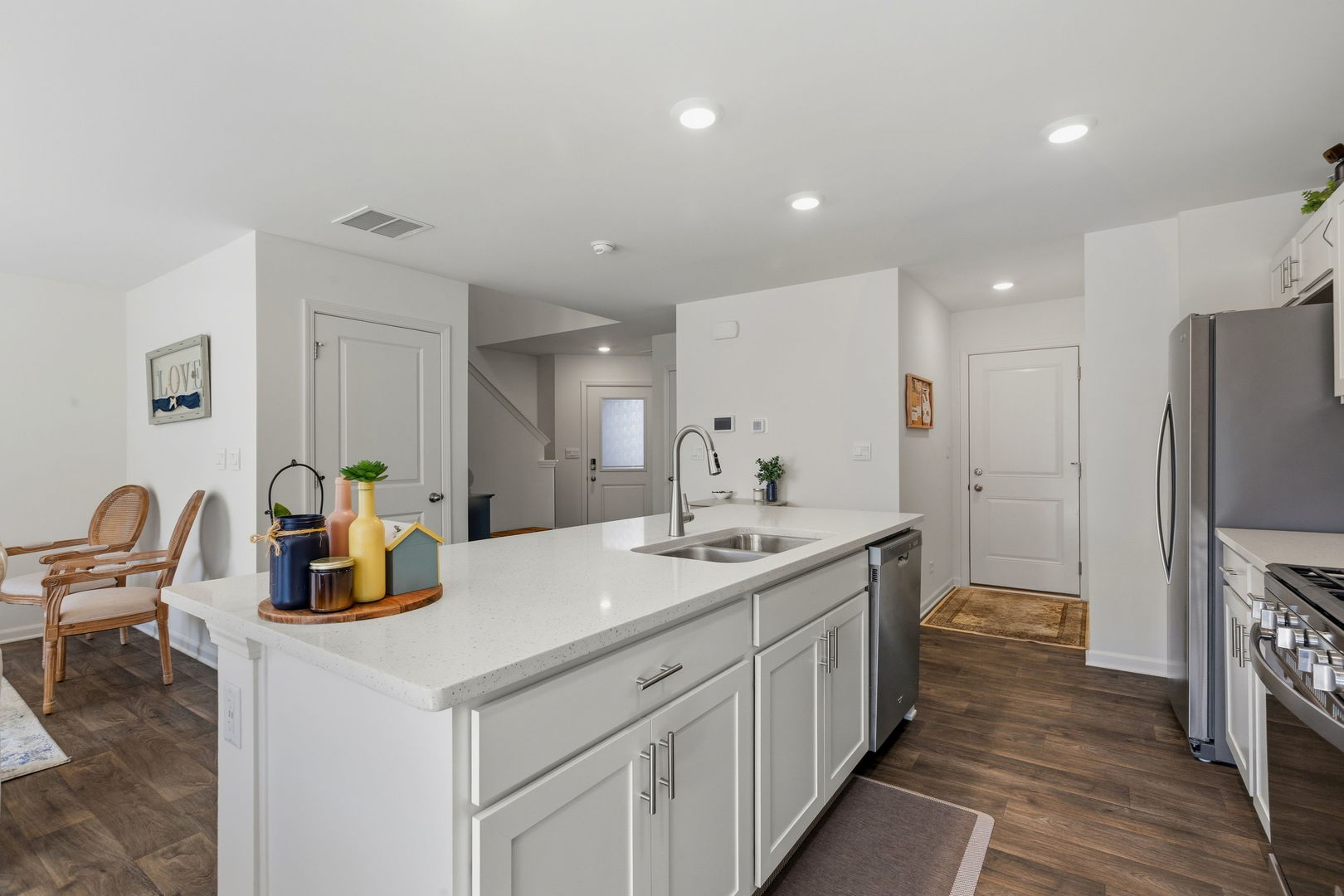 717 Wellington Lane Cary, IL 60013 - Photo 7 of 28 a kitchen with a sink and refrigerator