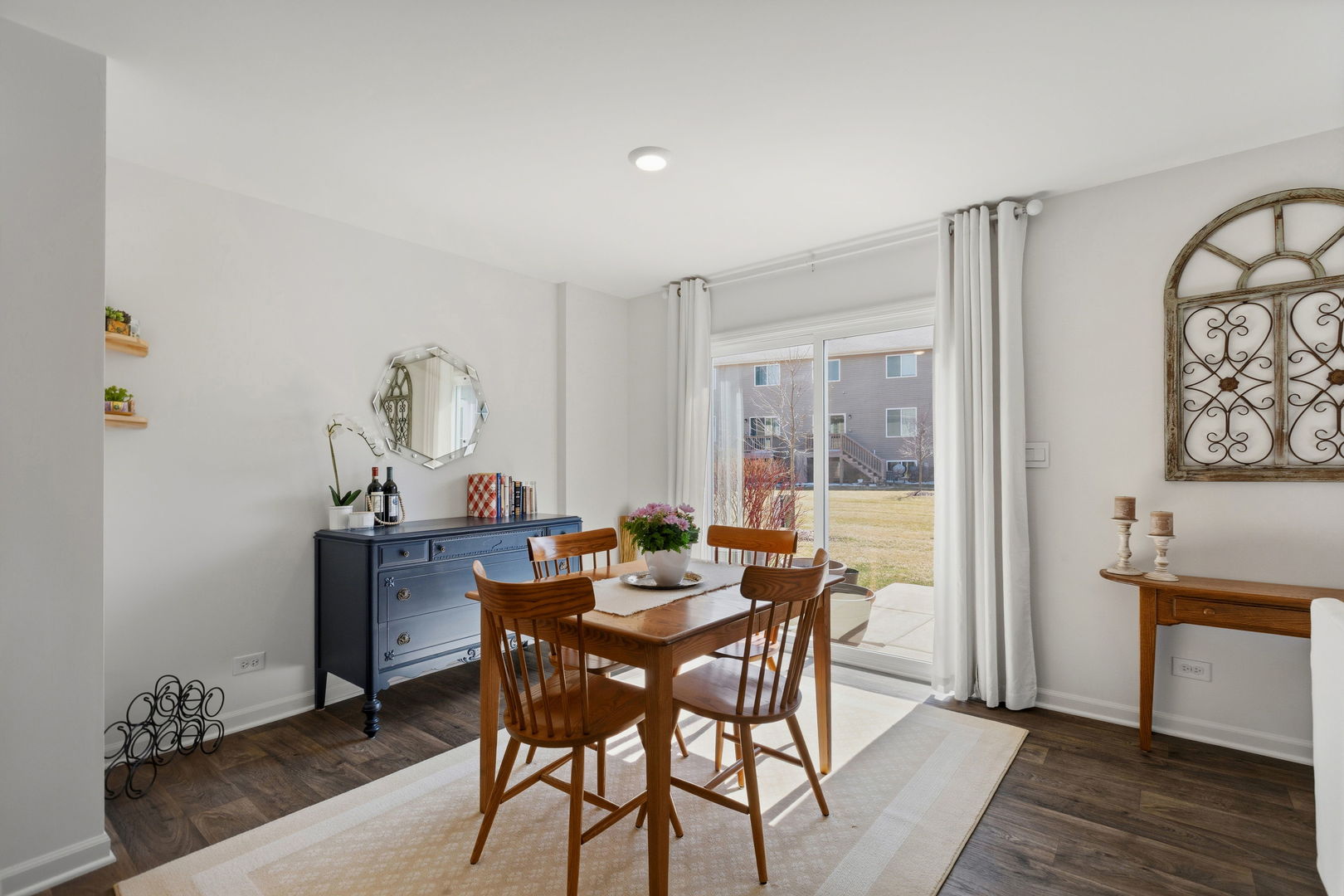 717 Wellington Lane Cary, IL 60013 - Photo 8 of 28 a view of a dining room with furniture and wooden floor