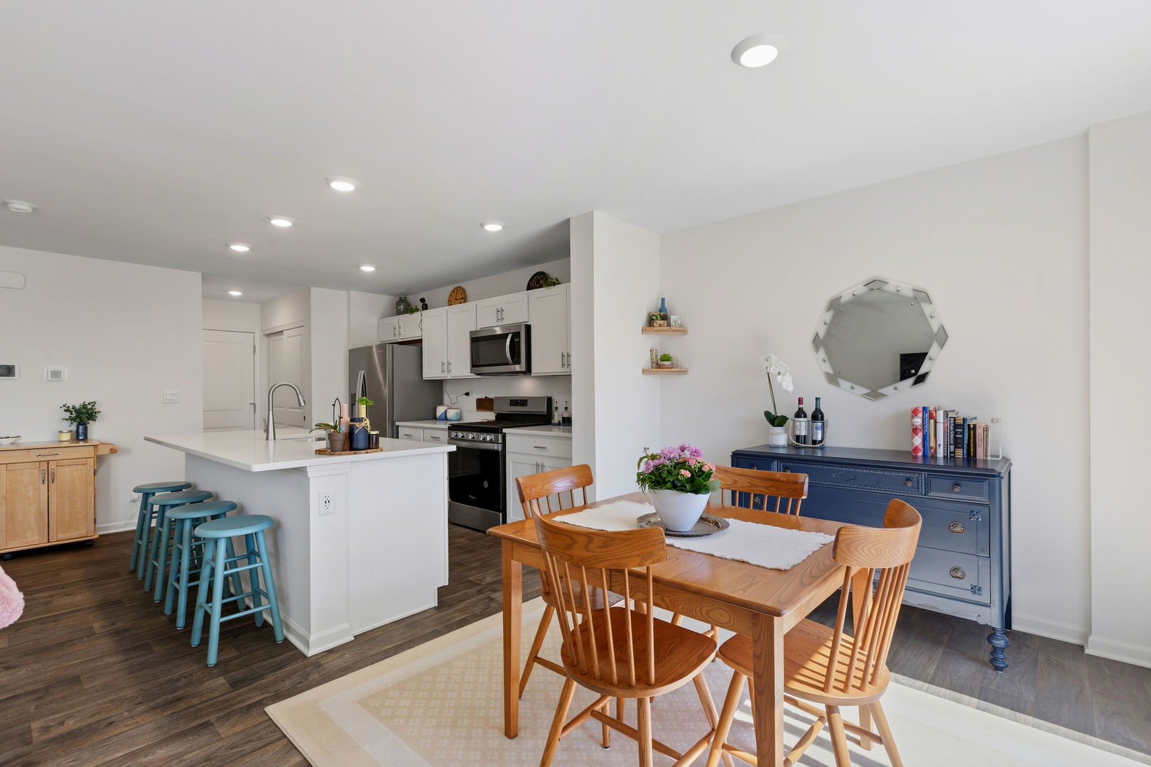 717 Wellington Lane Cary, IL 60013 - Photo 9 of 28 a dining room with furniture and kitchen view