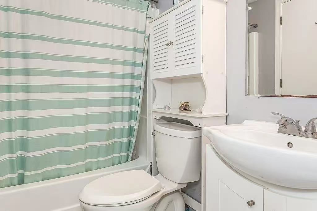 118 Burkhall Street, Unit S Weymouth, MA 02190 - Photo 4 of 7 a bathroom with a sink toilet and shower