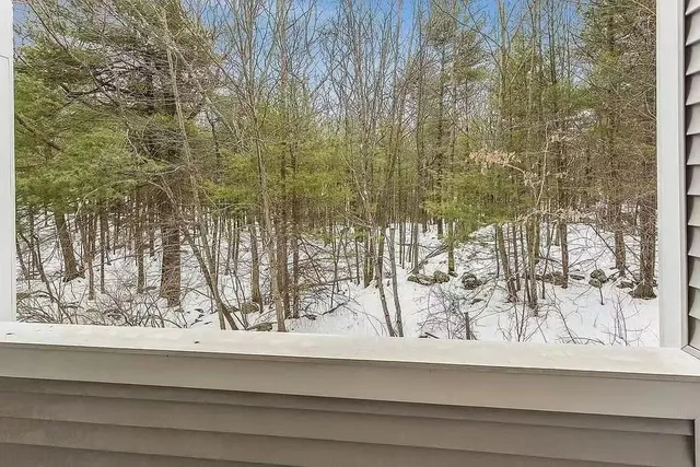 a view of a wooden floor and a window