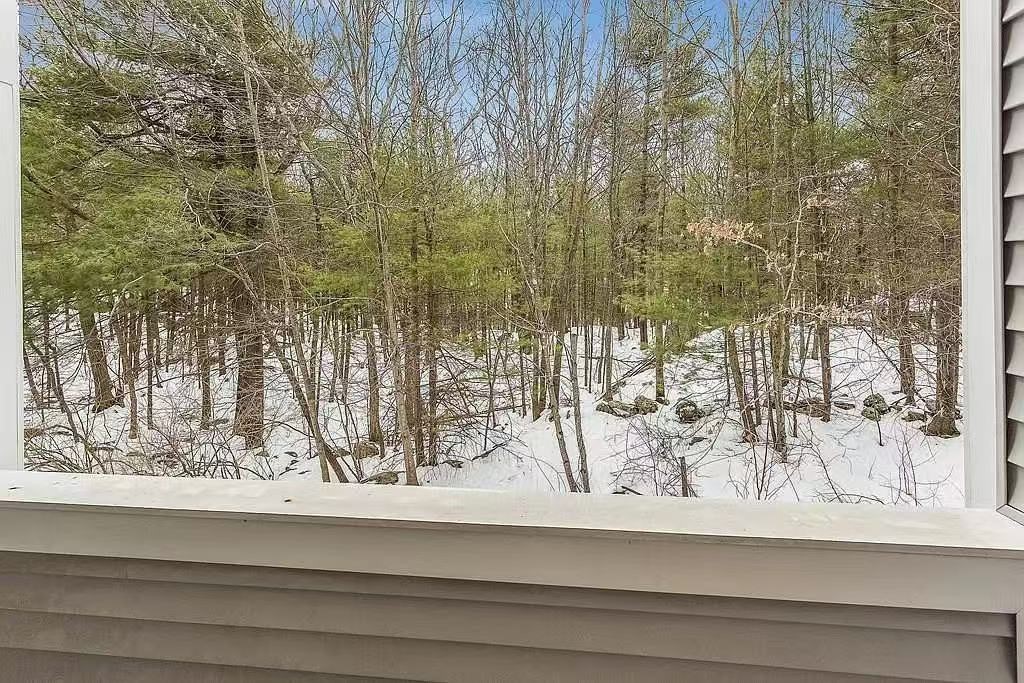 118 Burkhall Street, Unit S Weymouth, MA 02190 - Photo 5 of 7 a view of a wooden floor and a window