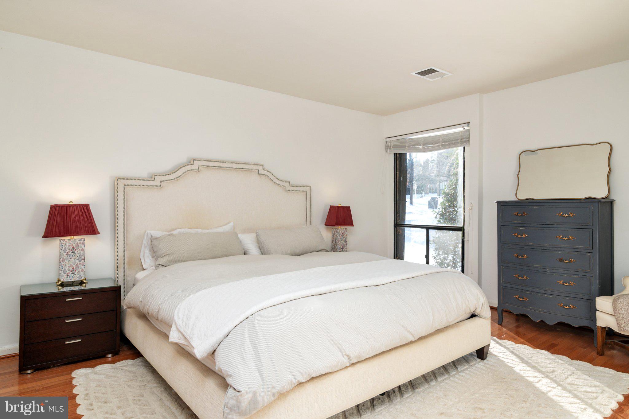 2110 Bonnywood Lane, Unit 3102 Silver Spring, MD 20902 - Photo 12 of 19 a bedroom with a bed and a closet