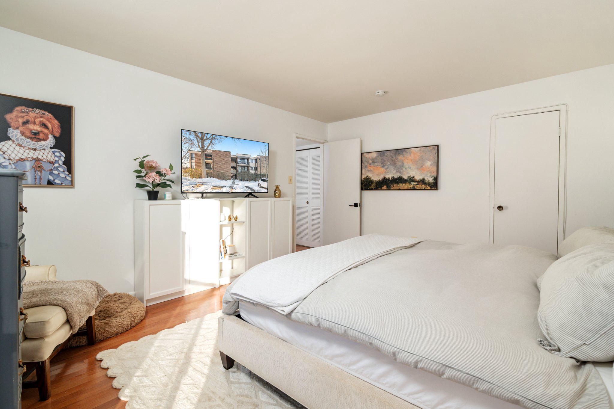 2110 Bonnywood Lane, Unit 3102 Silver Spring, MD 20902 - Photo 14 of 19 a bedroom with a bed and a window