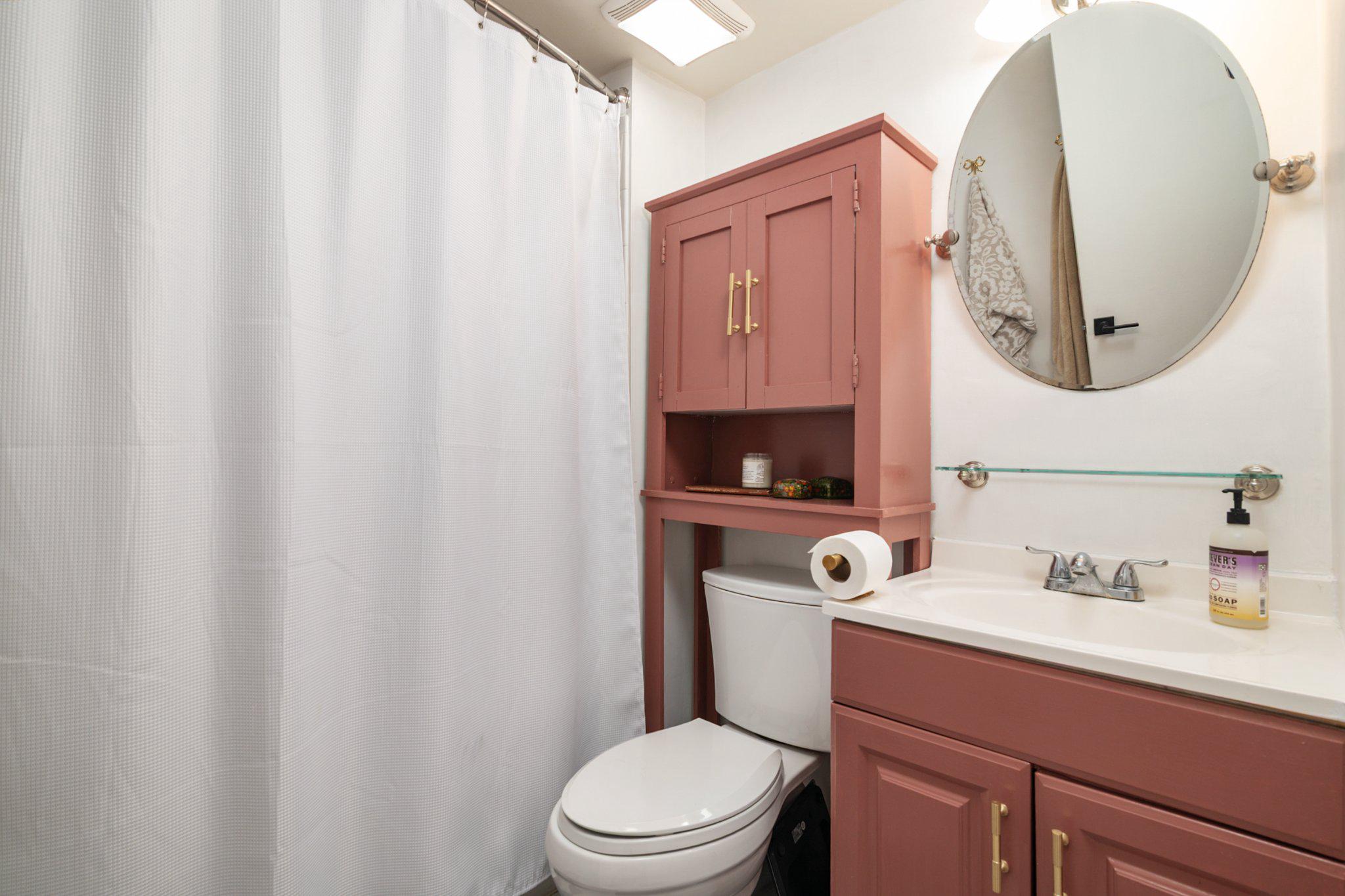 2110 Bonnywood Lane, Unit 3102 Silver Spring, MD 20902 - Photo 15 of 19 a bathroom with a toilet a sink and a mirror