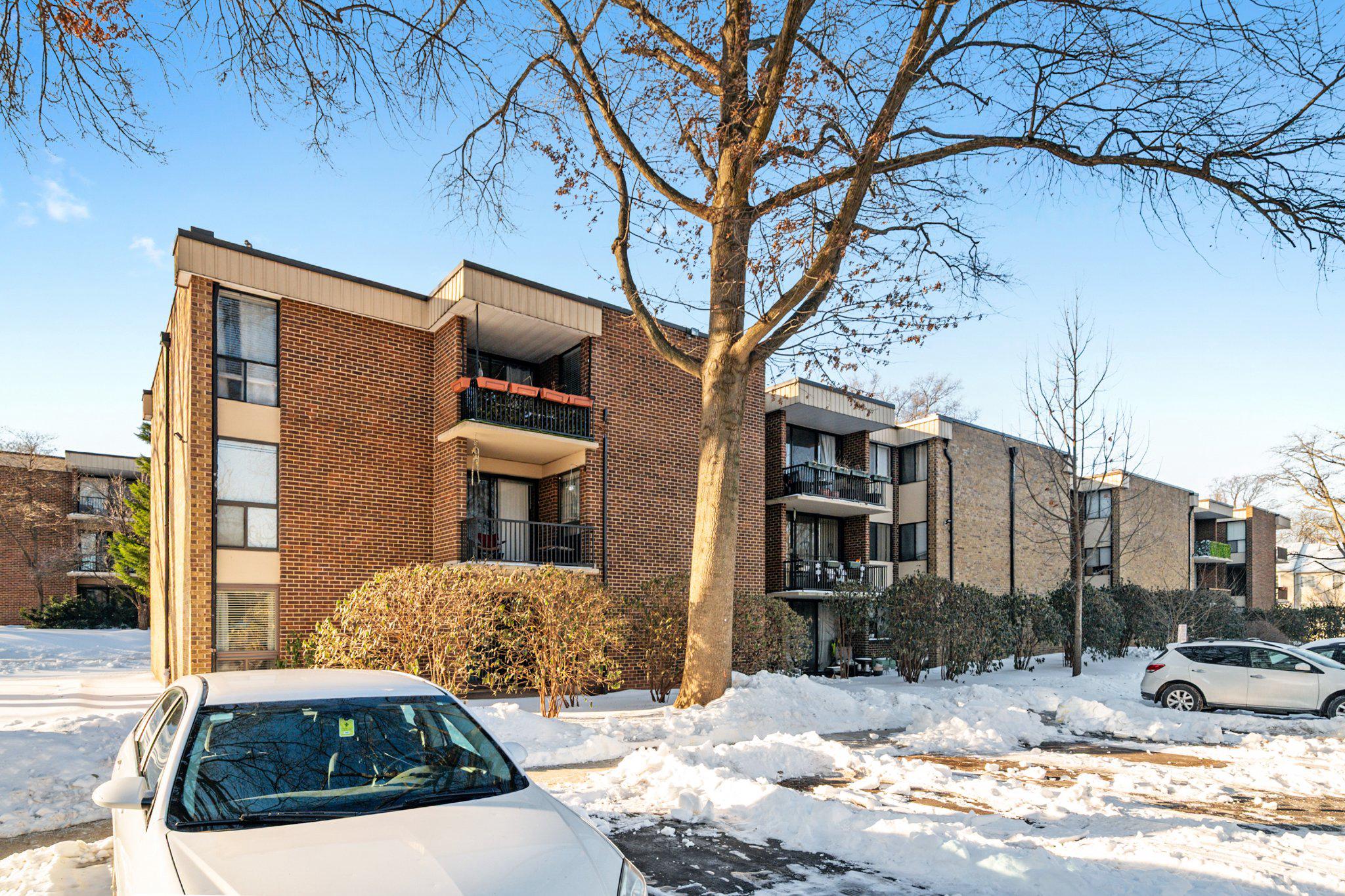 2110 Bonnywood Lane, Unit 3102 Silver Spring, MD 20902 - Photo 18 of 19 a view of a street with a tree in front of it