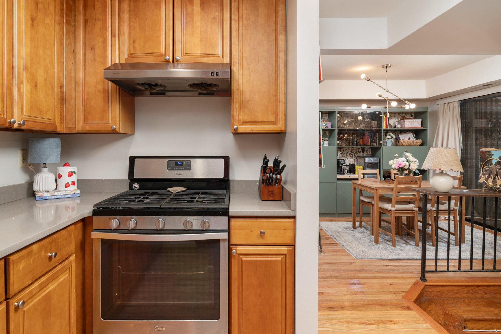 2110 Bonnywood Lane, Unit 3102 Silver Spring, MD 20902 - Photo 9 of 19 a kitchen with stainless steel appliances granite countertop a stove a sink and a microwave