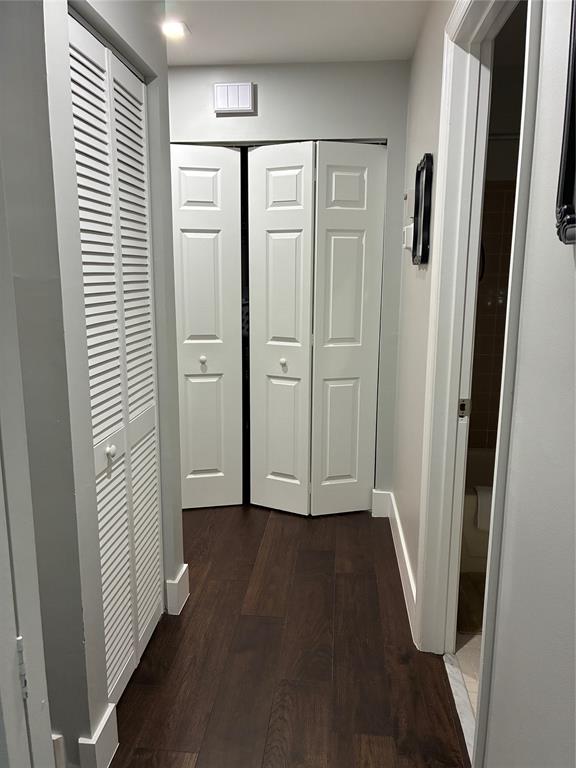 18546 Horizon Avenue, Unit 168 Boca Raton, FL 33496 - Photo 12 of 46 an entryway with wooden floor and cabinet
