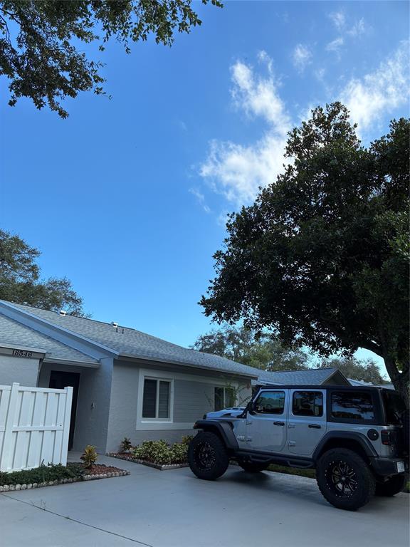 18546 Horizon Avenue, Unit 168 Boca Raton, FL 33496 - Photo 21 of 46 a car parked in front of house