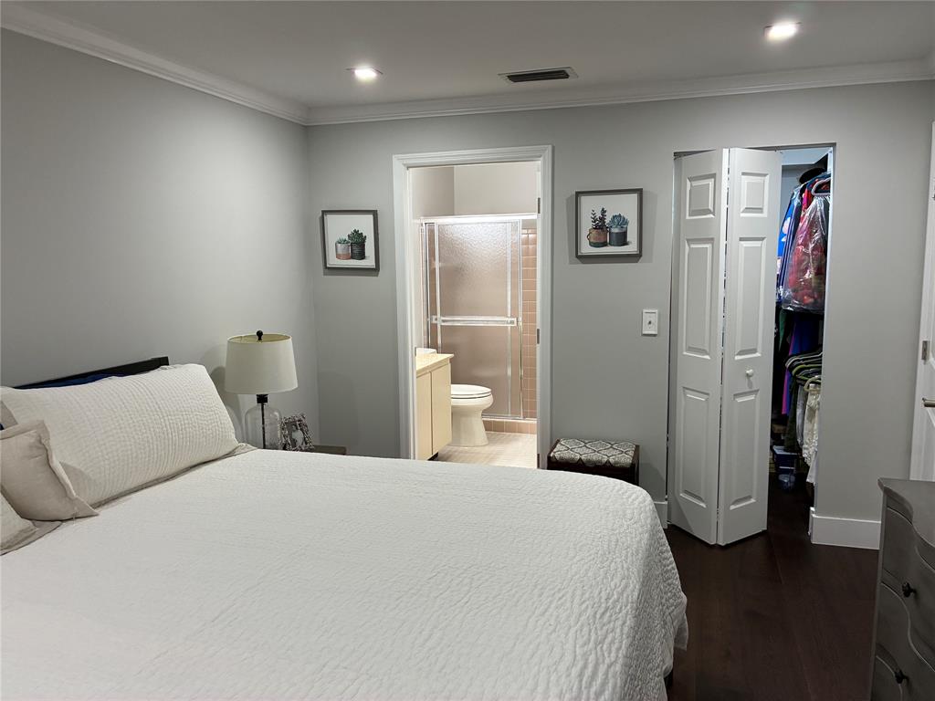 18546 Horizon Avenue, Unit 168 Boca Raton, FL 33496 - Photo 31 of 46 a bedroom with a bed and a walk in closet