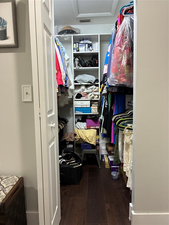 18546 Horizon Avenue, Unit 168 Boca Raton, FL 33496 - Photo 36 of 46 a view of walk in closet with clothes and shoes