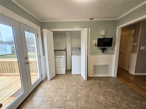 a view of empty room with a fireplace