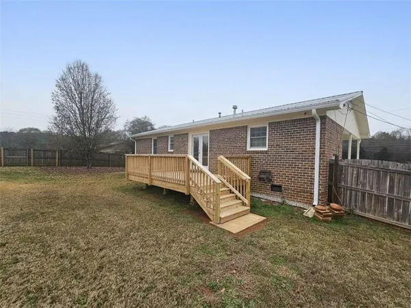 a house view with a backyard space