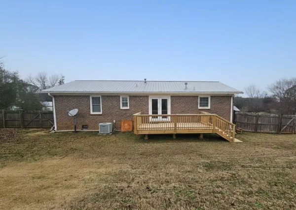 a view of a kitchen with utility area and windows