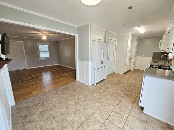 a view of hallway with wooden floor