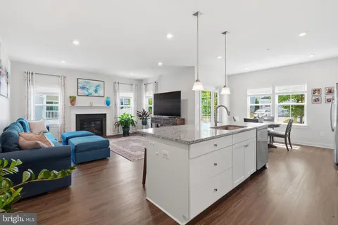 a large living room with fireplace furniture and a flat screen tv