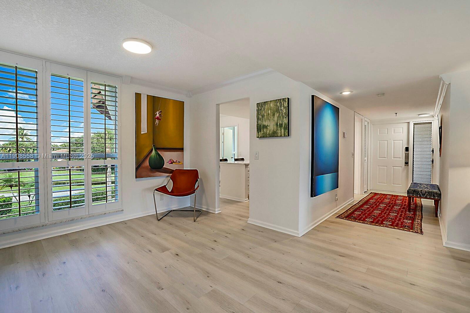 5390 Woodland Lakes Drive, Unit 301 Palm Beach Gardens, FL 33418 - Photo 11 of 34 a very nice looking room with a large window