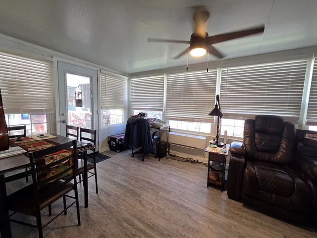 a livingroom with furniture window and wooden floor