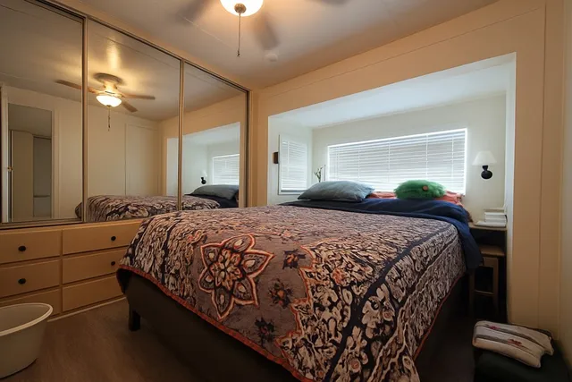 a bedroom with a bed and a dresser