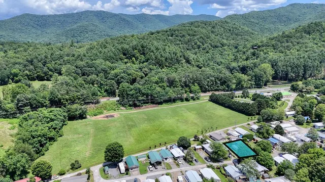 an aerial view of a golf course with parking space